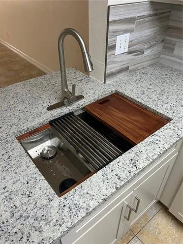 an empty room with wooden floor and closet