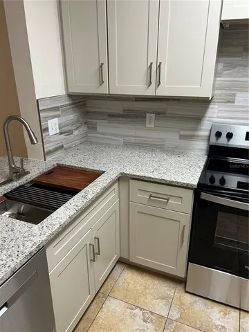 an empty room with wooden floor and closet