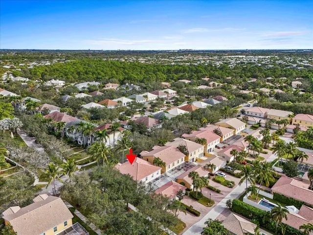 an aerial view of residential houses with city view