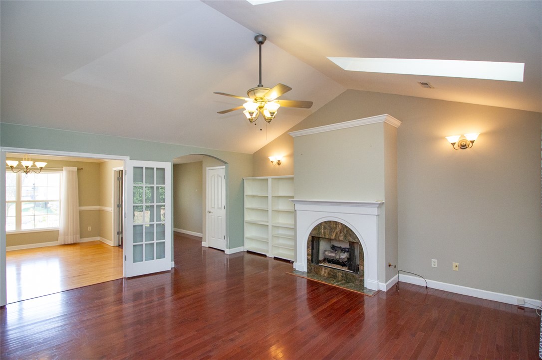 735 Britton Street Anderson, SC 29621 - Photo 13 of 49 This inviting space features elegant hardwood flooring and a charming fireplace, perfect for gatherings.