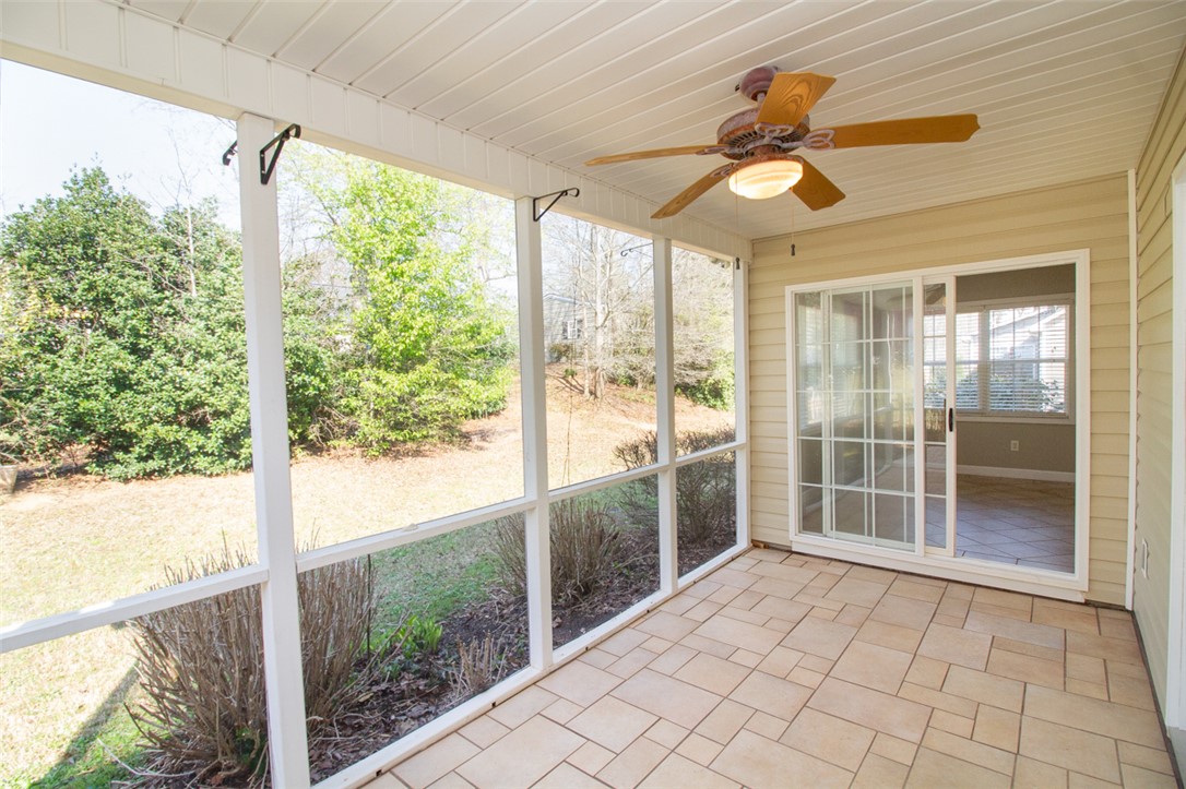 735 Britton Street Anderson, SC 29621 - Photo 16 of 49 This serene screened porch offers an ideal outdoor retreat, seamlessly connecting with the surrounding natural beauty.