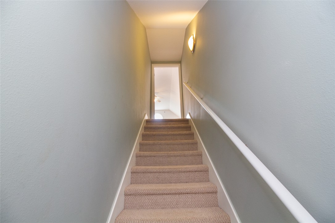 735 Britton Street Anderson, SC 29621 - Photo 38 of 49 This interior staircase features carpeted treads and a clean, modern aesthetic.