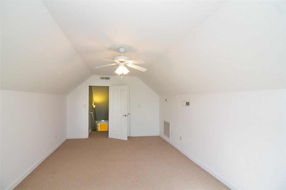 735 Britton Street Anderson, SC 29621 - Photo 41 of 49 This spacious Bonus room offers versatile living with sloped ceilings and soft carpeting.