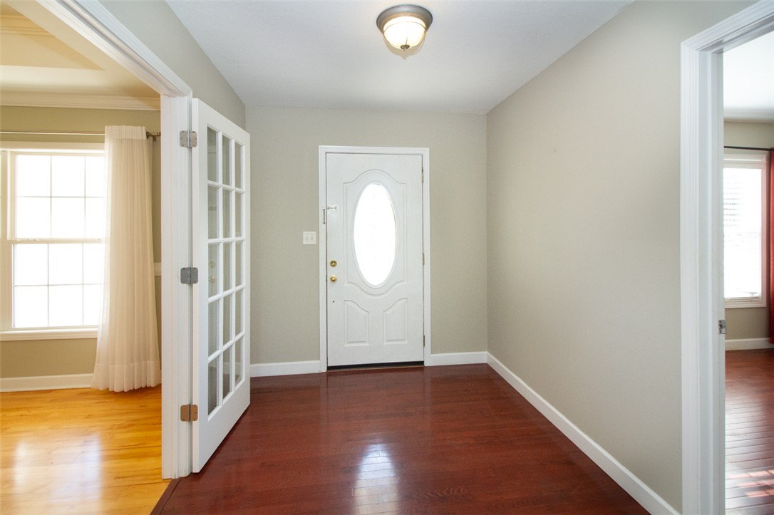 735 Britton Street Anderson, SC 29621 - Photo 7 of 49 Step into this welcoming entryway featuring warm wood floors and abundant natural light.