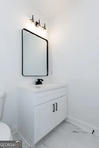 a bathroom with a toilet and a bathtub