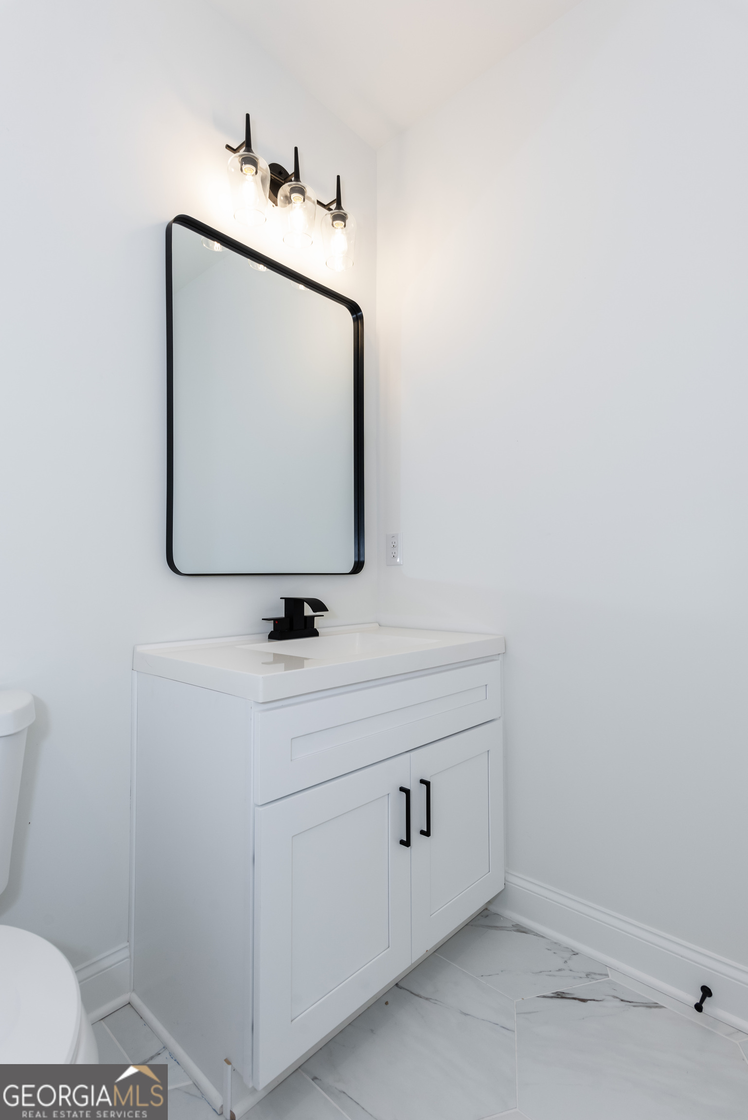3342 Landings S Drive Southwest Atlanta, GA 30331 - Photo 26 of 34 a bathroom with a sink and a mirror