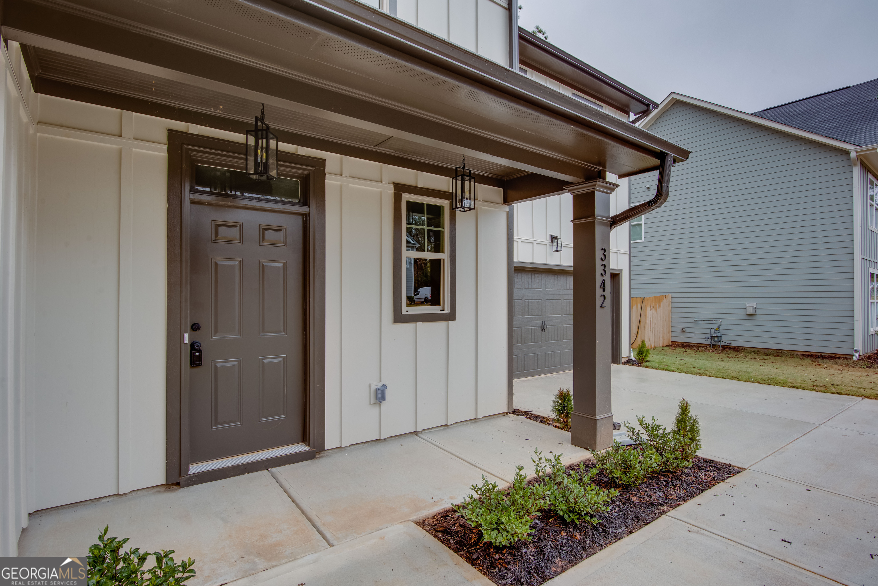 3342 Landings S Drive Southwest Atlanta, GA 30331 - Photo 4 of 34 a front view of a house with a garage