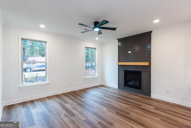 a kitchen with a refrigerator a sink and cabinets