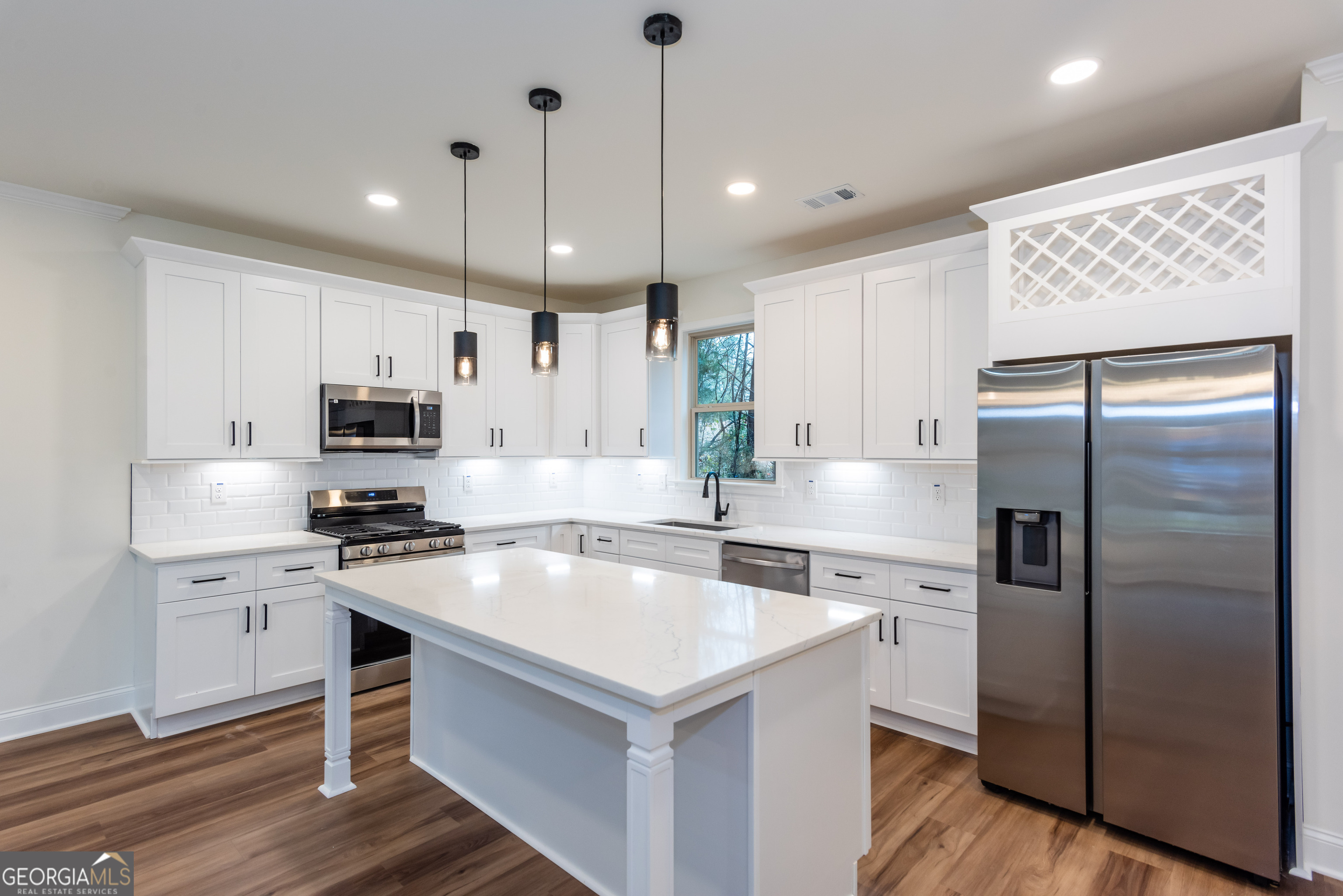 3342 Landings S Drive Southwest Atlanta, GA 30331 - Photo 10 of 34 a kitchen with a refrigerator a sink and cabinets