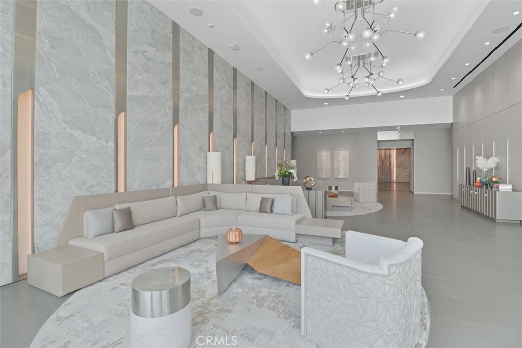 877 Francisco Street, Unit 3102 Los Angeles, CA 90017 - Photo 22 of 36 a living room with furniture and a chandelier