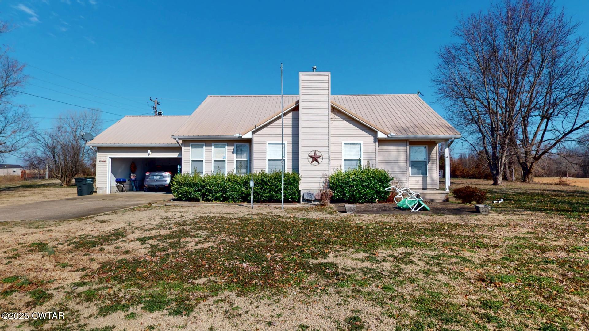 4836 Lightfoot Luckett Road Ripley, TN 38063 - Photo 1 of 23 a front view of a house with a yard