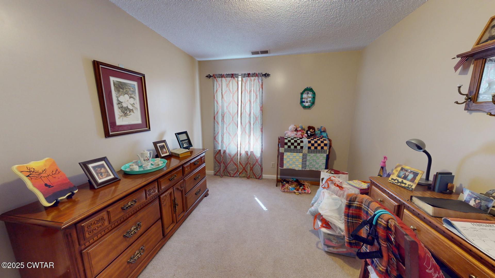 4836 Lightfoot Luckett Road Ripley, TN 38063 - Photo 12 of 23 a bedroom with furniture and a window