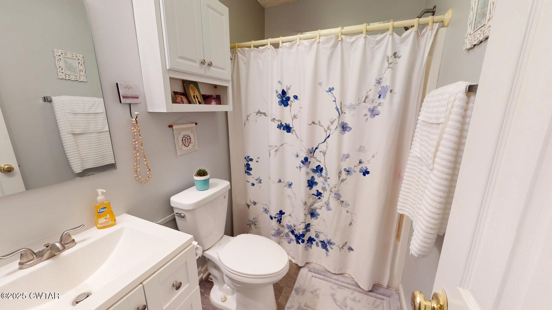 4836 Lightfoot Luckett Road Ripley, TN 38063 - Photo 15 of 23 a bathroom with a sink toilet and shower