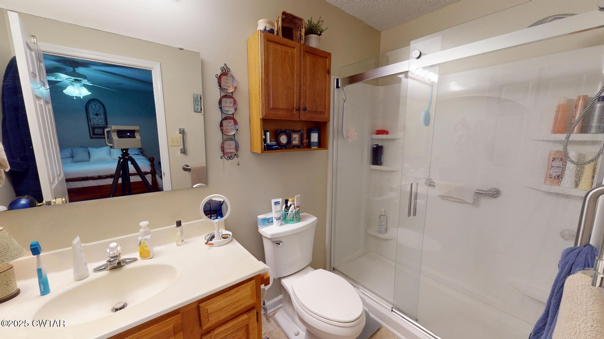 4836 Lightfoot Luckett Road Ripley, TN 38063 - Photo 18 of 23 a bathroom with a sink toilet and shower