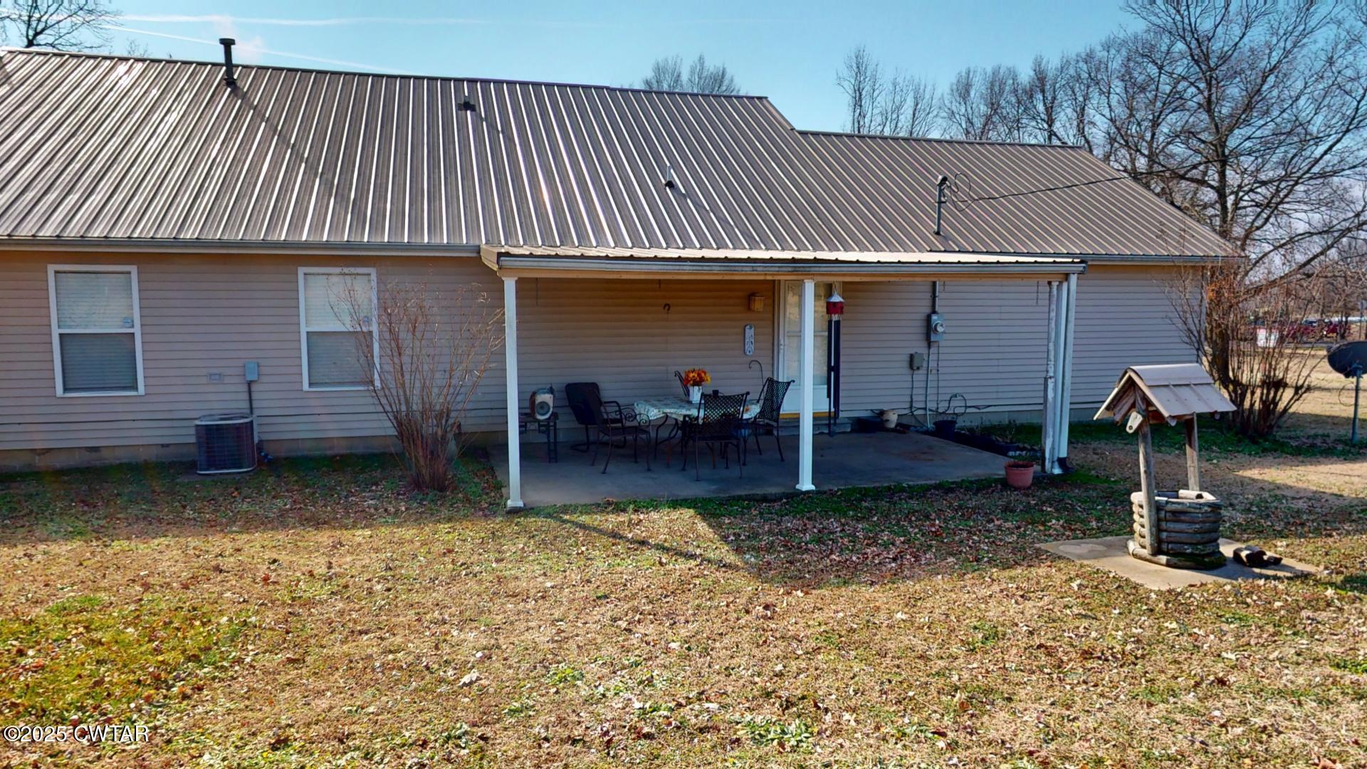 4836 Lightfoot Luckett Road Ripley, TN 38063 - Photo 4 of 23 a view of a house with a patio and a wooden fence