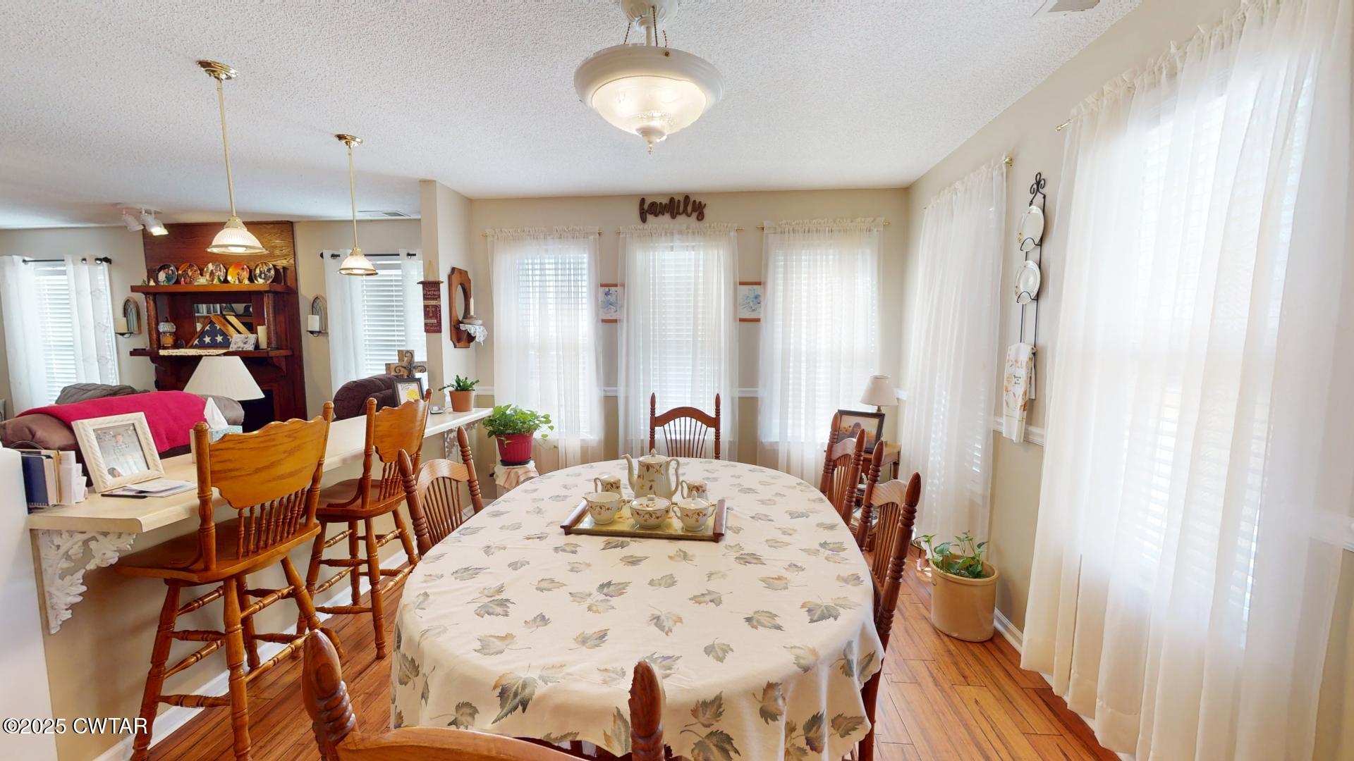 4836 Lightfoot Luckett Road Ripley, TN 38063 - Photo 5 of 23 a view of a dining room with furniture and a chandelier