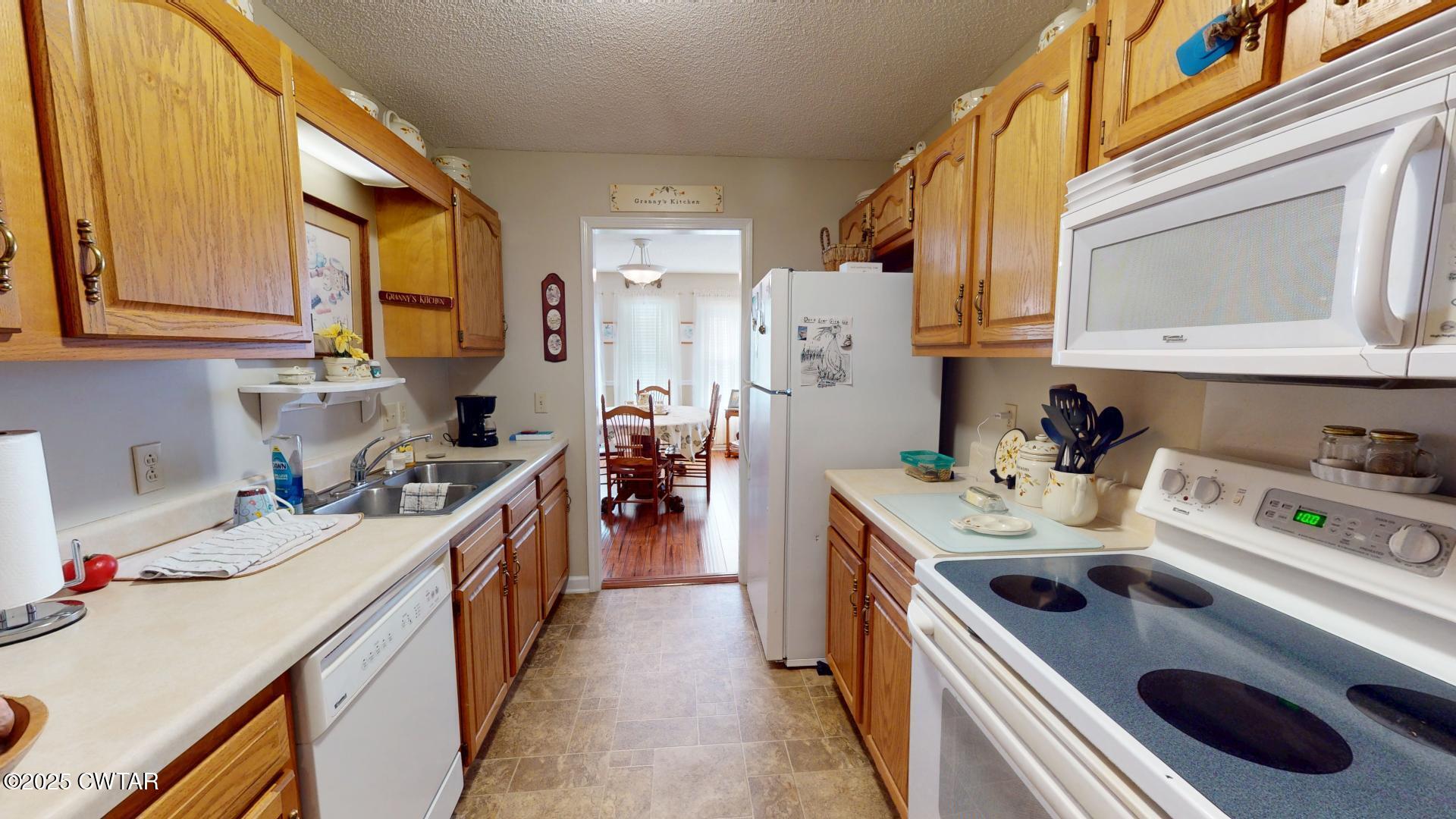 4836 Lightfoot Luckett Road Ripley, TN 38063 - Photo 6 of 23 a kitchen with a sink stove top oven and cabinets