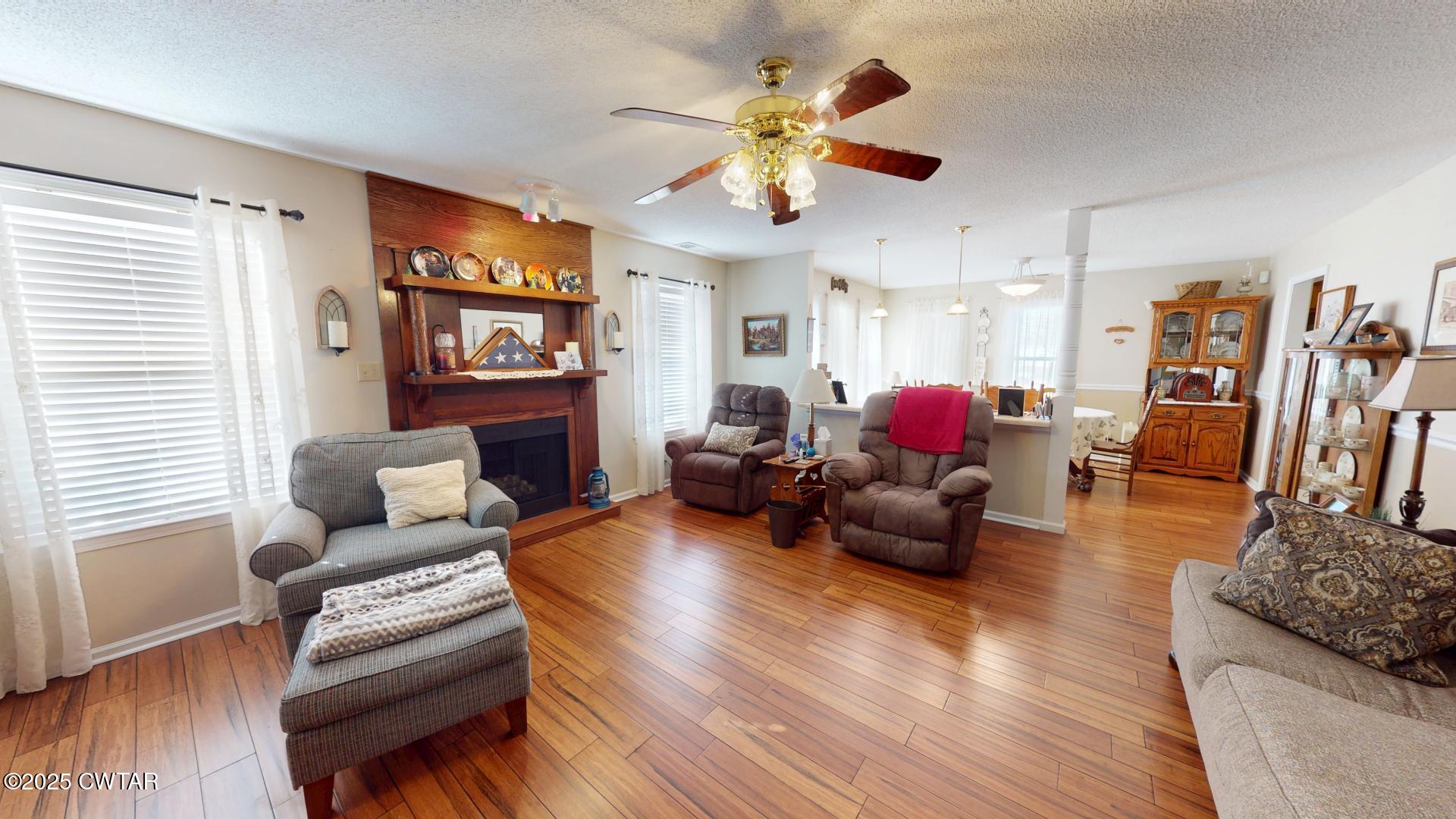 4836 Lightfoot Luckett Road Ripley, TN 38063 - Photo 9 of 23 a living room with furniture kitchen view and a wooden floor