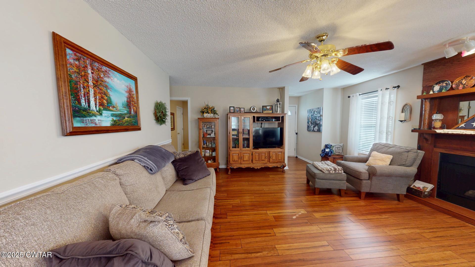4836 Lightfoot Luckett Road Ripley, TN 38063 - Photo 10 of 23 a living room with furniture and wooden floor