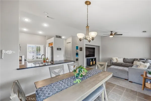 a bathroom with a sink a toilet and shower curtain