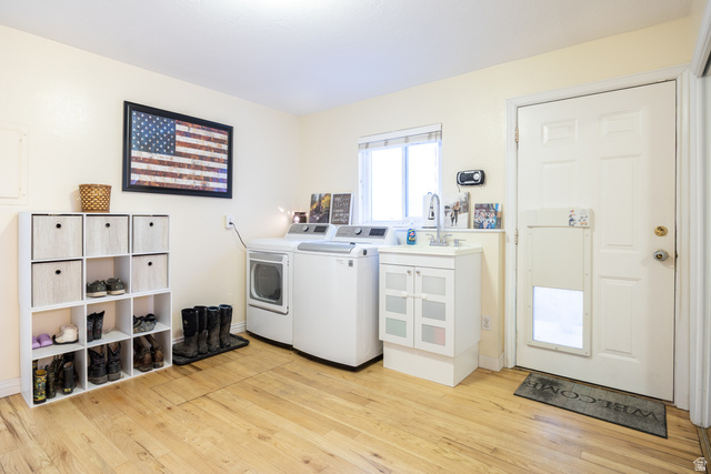 1981 South Main Street Lewiston, UT 84320 - Photo 14 of 47 Laundry room featuring light wood-type flooring and washer and clothes dryer