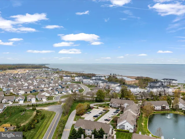 a view of a room with wooden floor and white walls