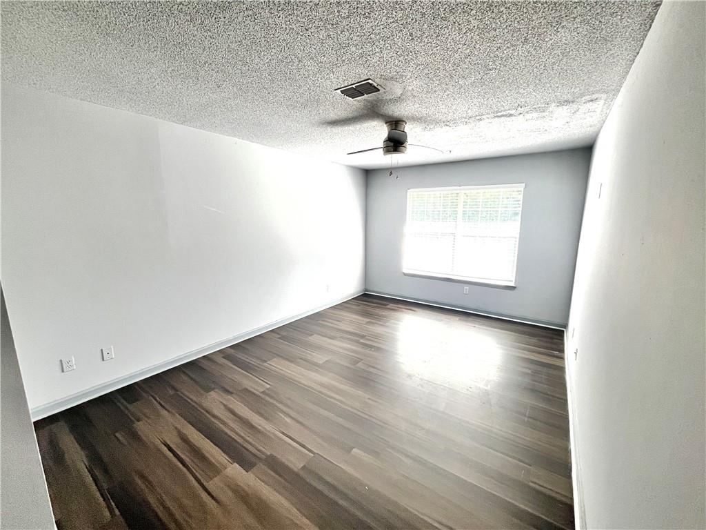 3622 Shepherds Path Decatur, GA 30034 - Photo 12 of 28 a view of empty room with wooden floor and fan