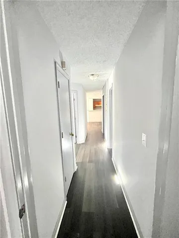 a view of gallery with wooden floor