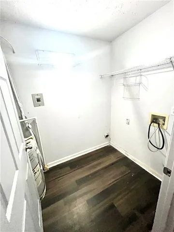 a view of a room with rack and wooden floor