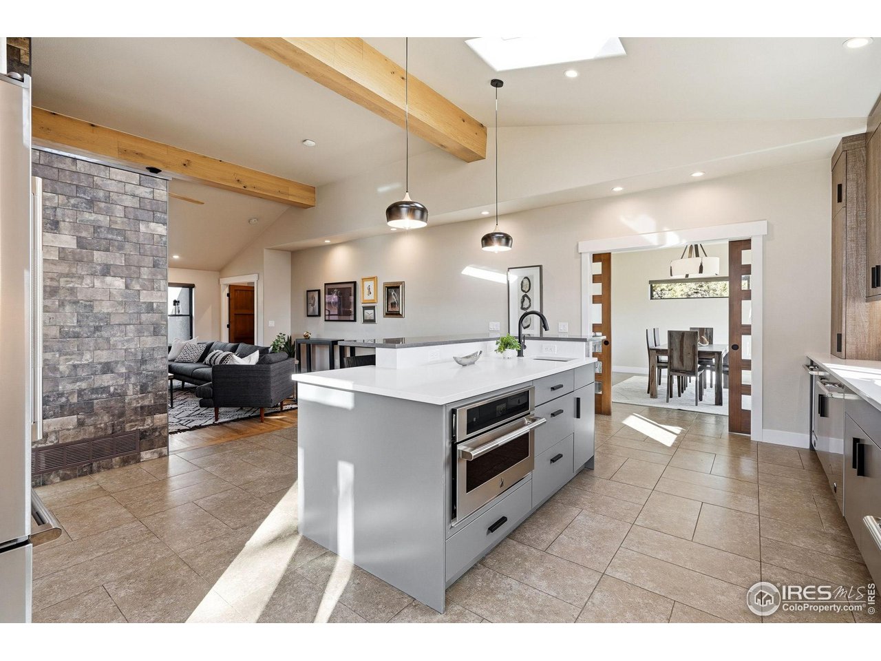 12212 Cash Road Longmont, CO 80503 - Photo 13 of 47 a view of kitchen with sink and living room