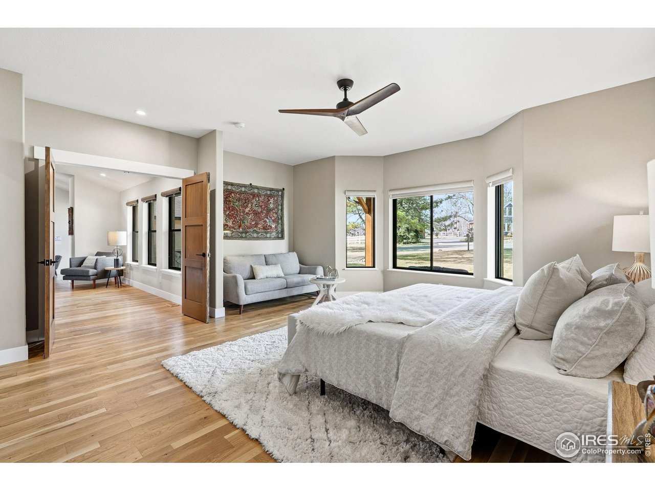 12212 Cash Road Longmont, CO 80503 - Photo 18 of 47 a bedroom with a large bed and a window