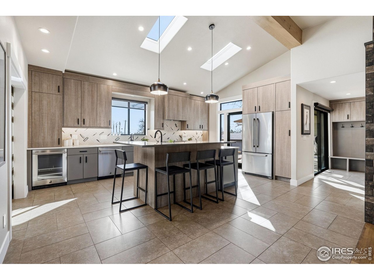 12212 Cash Road Longmont, CO 80503 - Photo 2 of 47 a living room with stainless steel appliances kitchen island granite countertop furniture and a view of kitchen