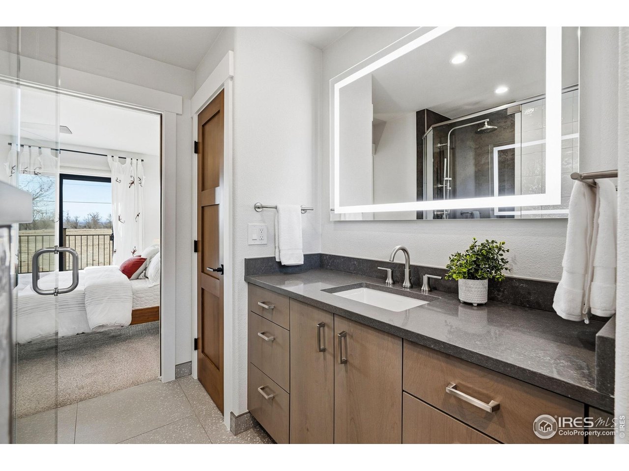 12212 Cash Road Longmont, CO 80503 - Photo 23 of 47 a bathroom with a sink and a mirror