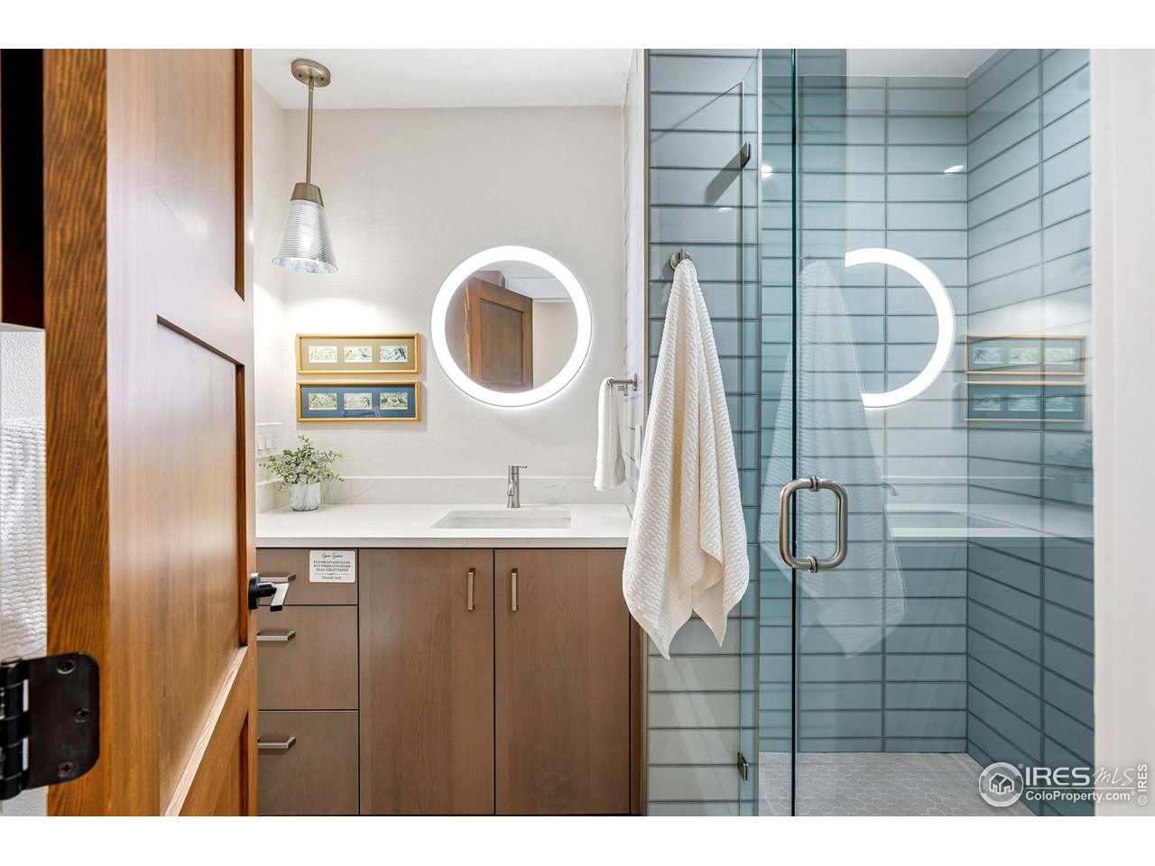 12212 Cash Road Longmont, CO 80503 - Photo 27 of 47 a bathroom with a sink and mirror