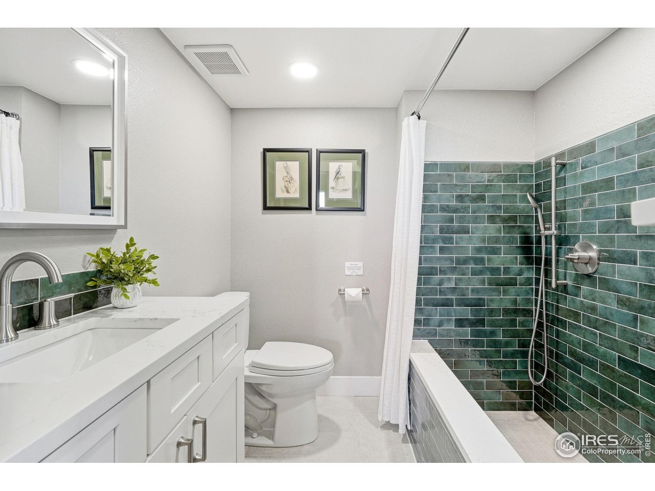 12212 Cash Road Longmont, CO 80503 - Photo 29 of 47 a bathroom with a sink a toilet and shower