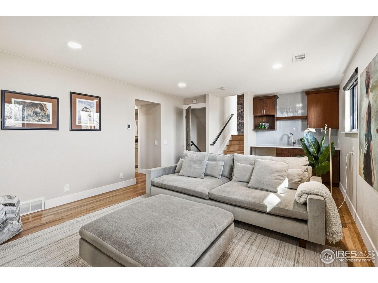 12212 Cash Road Longmont, CO 80503 - Photo 31 of 47 a living room with furniture and a flat screen tv