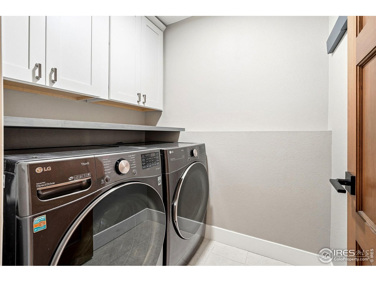 12212 Cash Road Longmont, CO 80503 - Photo 32 of 47 a utility room with dryer and washer