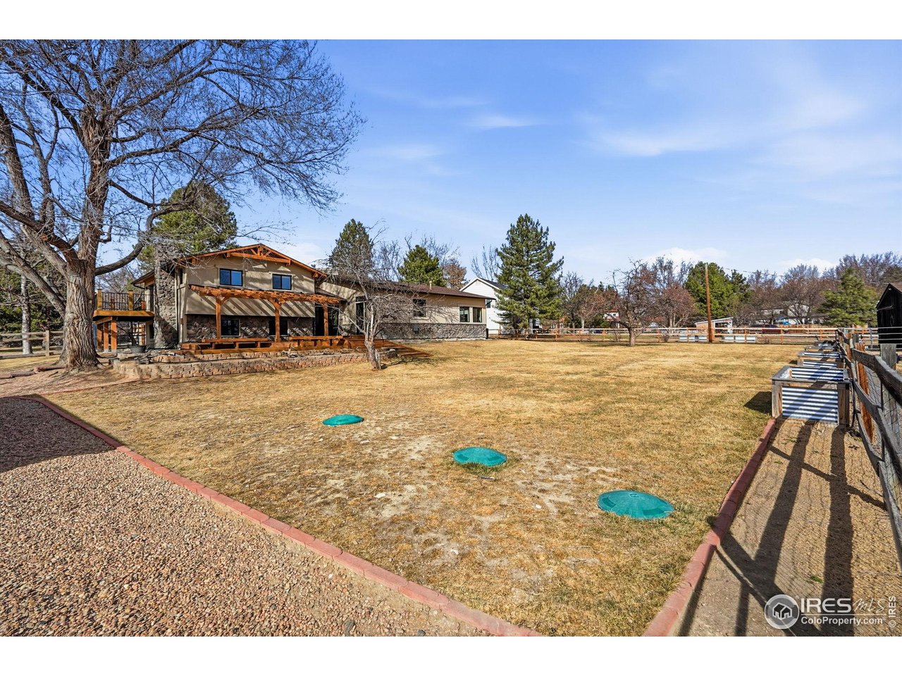 12212 Cash Road Longmont, CO 80503 - Photo 38 of 47 a swimming pool with outdoor seating and trees in the background