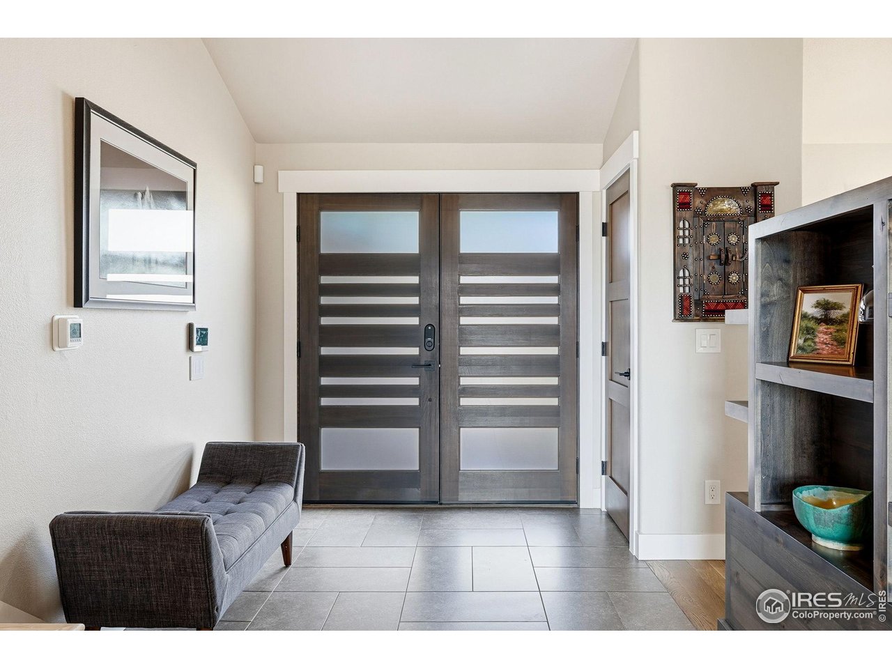 12212 Cash Road Longmont, CO 80503 - Photo 8 of 47 a living room with furniture and a flat screen tv