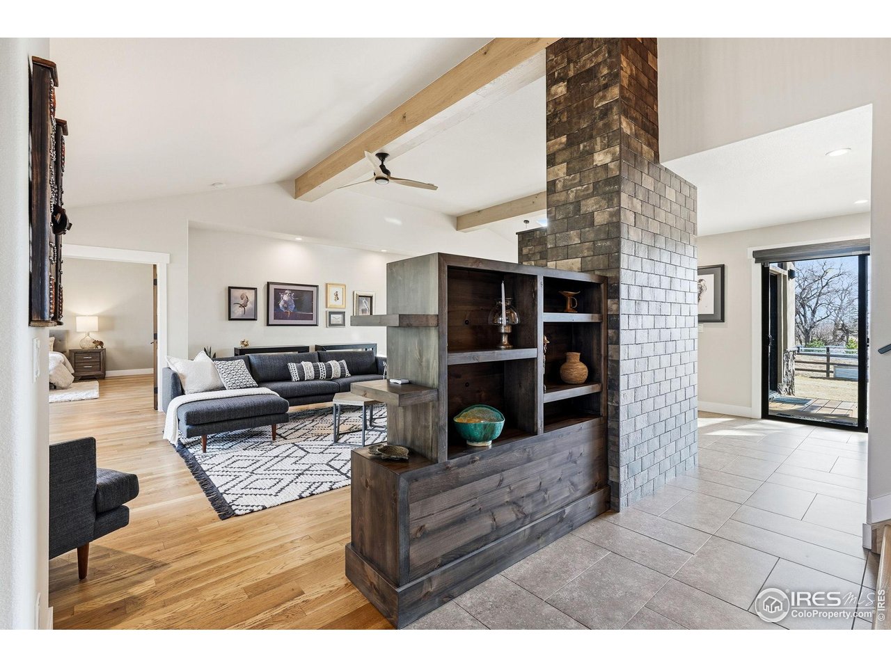 12212 Cash Road Longmont, CO 80503 - Photo 47 of 47 a living room with furniture and a fireplace