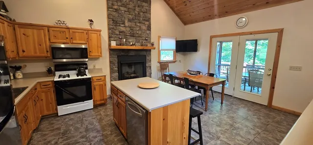 a kitchen with a stove a sink and a refrigerator