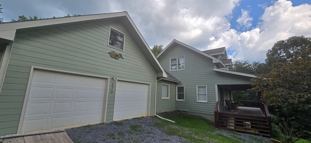 376 Crestview Drive Morganton, GA 30560 - Photo 2 of 37 a front view of a house with garden