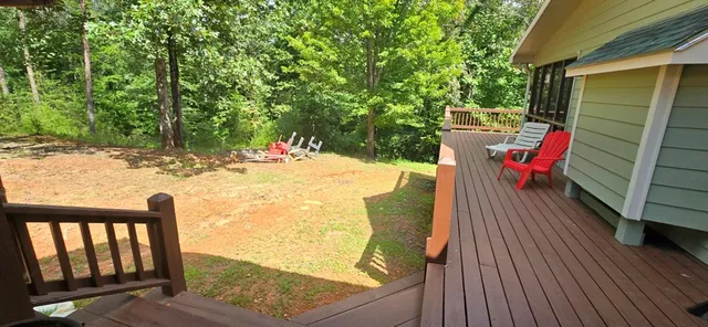 a view of two chairs in the balcony