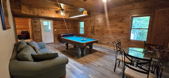 a living room with furniture a window and a table