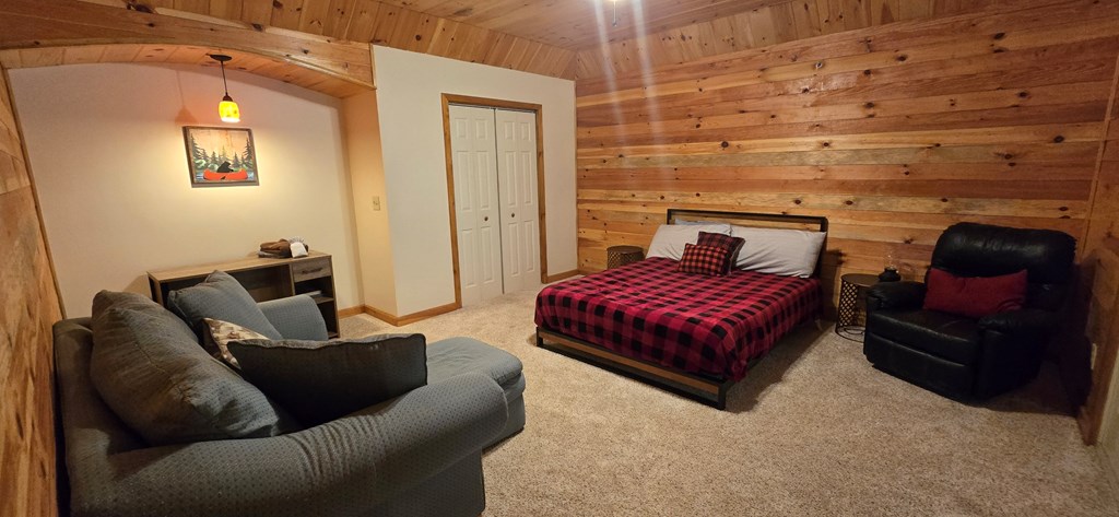 376 Crestview Drive Morganton, GA 30560 - Photo 30 of 37 a bedroom with a bed and wooden floor