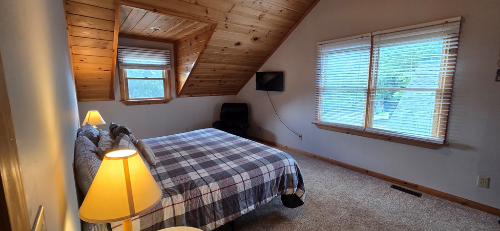 376 Crestview Drive Morganton, GA 30560 - Photo 32 of 37 a bedroom with a bed and a window