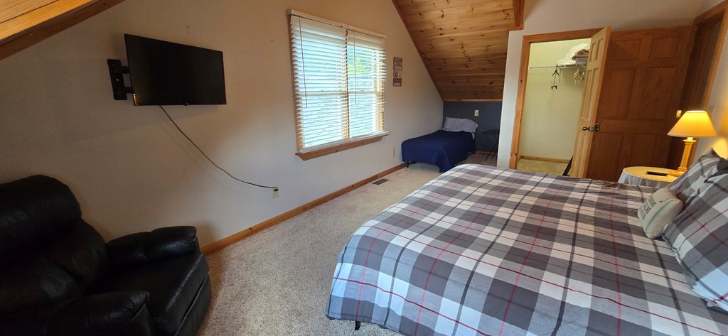 376 Crestview Drive Morganton, GA 30560 - Photo 33 of 37 a bedroom with a bed and a television