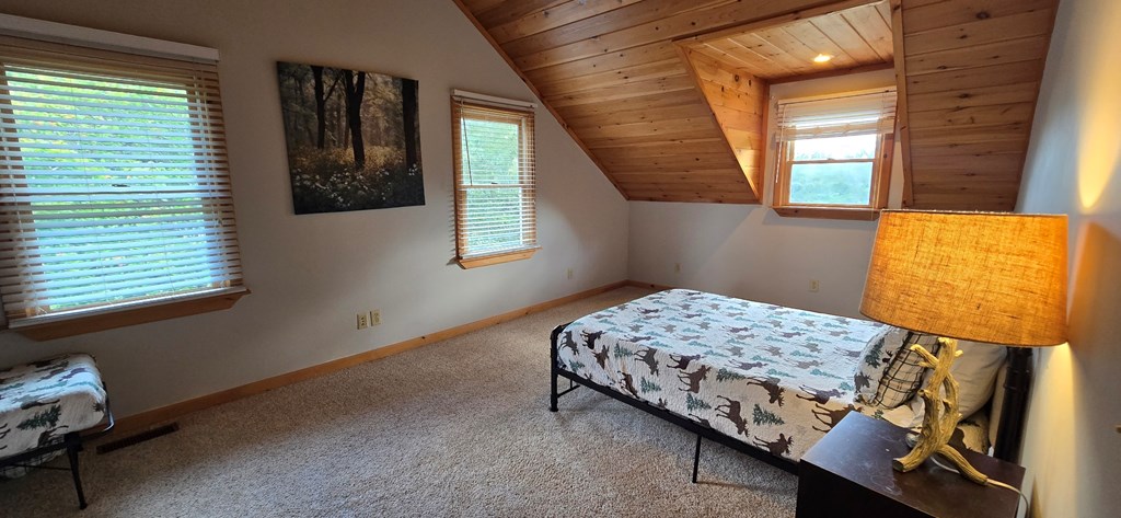 376 Crestview Drive Morganton, GA 30560 - Photo 35 of 37 a bedroom with a bed and a window