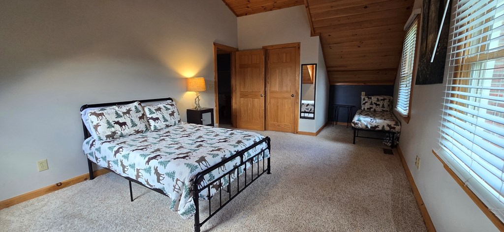 376 Crestview Drive Morganton, GA 30560 - Photo 36 of 37 a bedroom with a bed and window