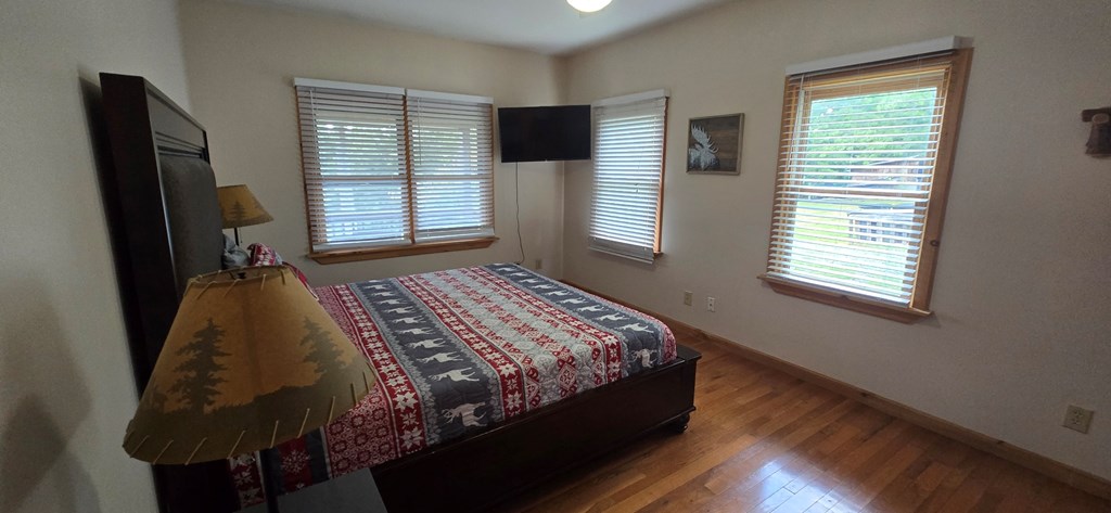 376 Crestview Drive Morganton, GA 30560 - Photo 8 of 37 a bed sitting in a bedroom next to a window